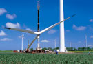 Image:  Assembly of a wind turbine in an arable field